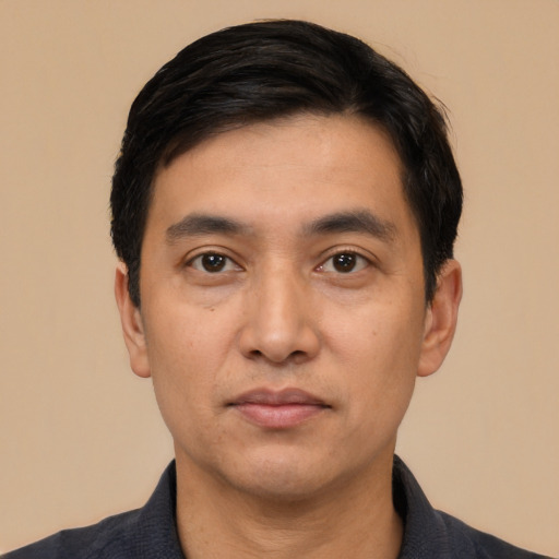 Neutral white young-adult male with short  black hair and brown eyes