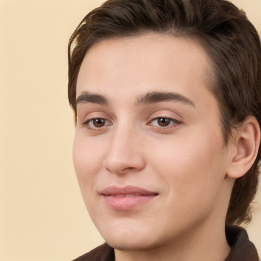 Joyful white young-adult male with medium  brown hair and brown eyes