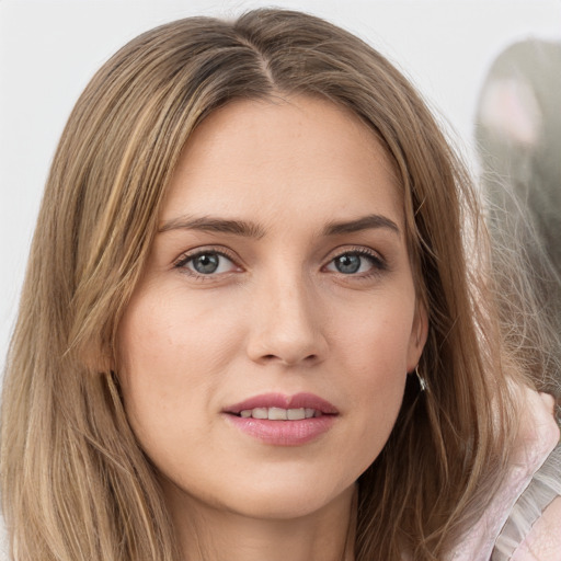 Joyful white young-adult female with long  brown hair and grey eyes