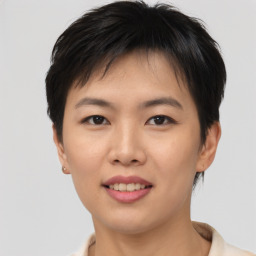 Joyful asian young-adult female with short  brown hair and brown eyes