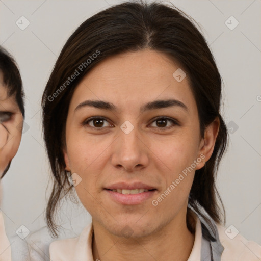 Joyful white young-adult female with medium  brown hair and brown eyes