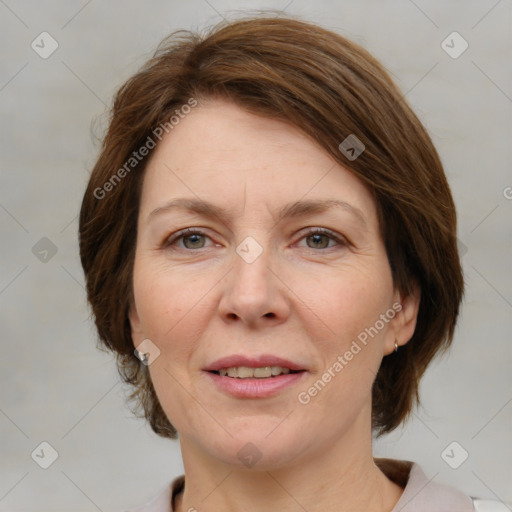 Joyful white adult female with medium  brown hair and grey eyes