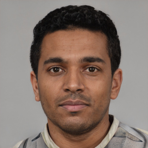 Neutral latino young-adult male with short  black hair and brown eyes