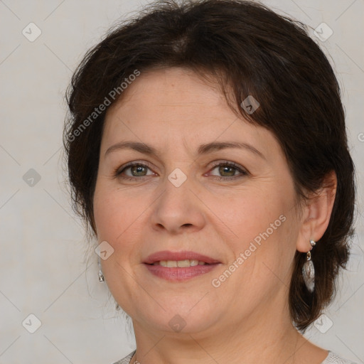 Joyful white adult female with medium  brown hair and grey eyes