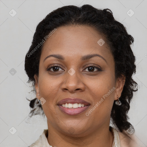 Joyful latino adult female with long  brown hair and brown eyes