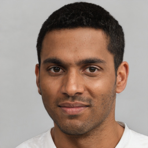 Neutral black young-adult male with short  black hair and brown eyes
