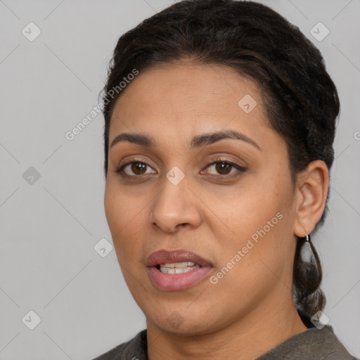 Joyful latino young-adult female with short  brown hair and brown eyes