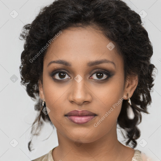 Joyful black young-adult female with long  brown hair and brown eyes