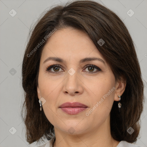 Joyful white adult female with medium  brown hair and brown eyes