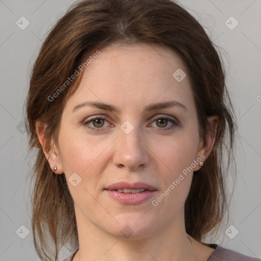 Joyful white adult female with medium  brown hair and grey eyes