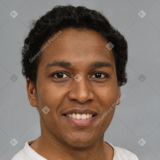 Joyful latino young-adult male with short  brown hair and brown eyes