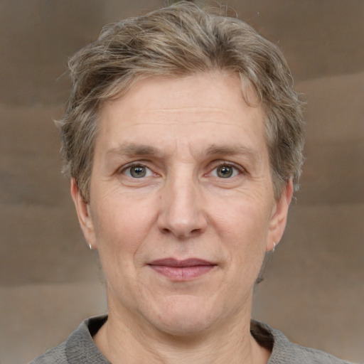 Joyful white middle-aged male with short  brown hair and grey eyes