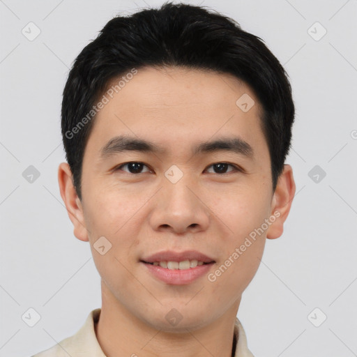 Joyful asian young-adult male with short  brown hair and brown eyes