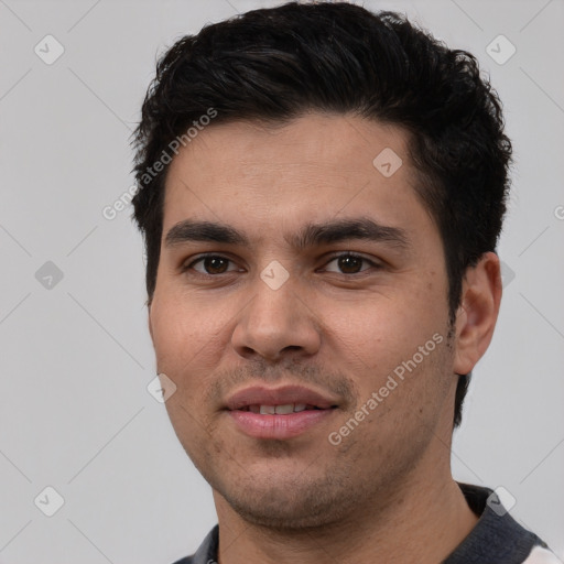 Joyful white young-adult male with short  black hair and brown eyes