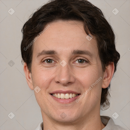 Joyful white adult male with medium  brown hair and brown eyes