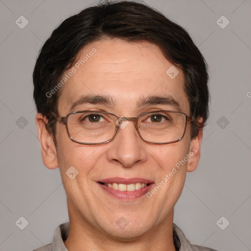 Joyful white adult male with short  brown hair and brown eyes