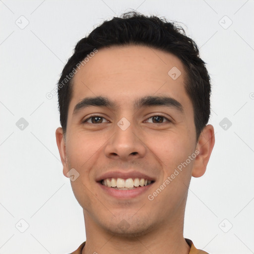 Joyful white young-adult male with short  black hair and brown eyes