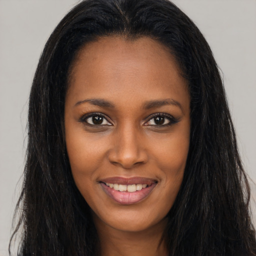 Joyful asian young-adult female with long  brown hair and brown eyes