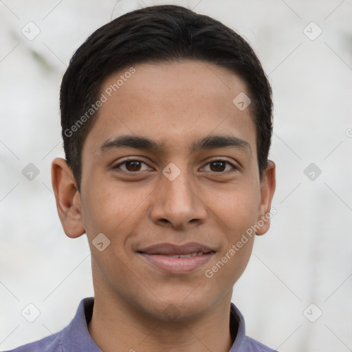 Joyful latino young-adult male with short  brown hair and brown eyes