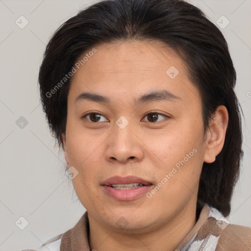 Joyful asian young-adult female with medium  brown hair and brown eyes