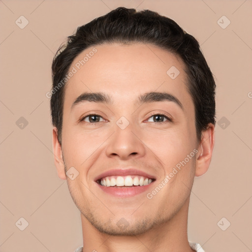 Joyful white young-adult male with short  black hair and brown eyes