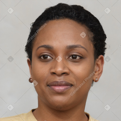 Joyful black young-adult female with short  black hair and brown eyes