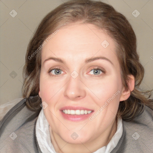 Joyful white adult female with medium  brown hair and blue eyes