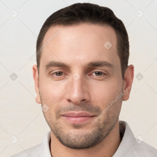 Joyful white young-adult male with short  brown hair and brown eyes