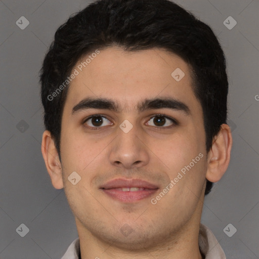 Joyful latino young-adult male with short  brown hair and brown eyes