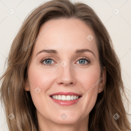 Joyful white young-adult female with long  brown hair and blue eyes