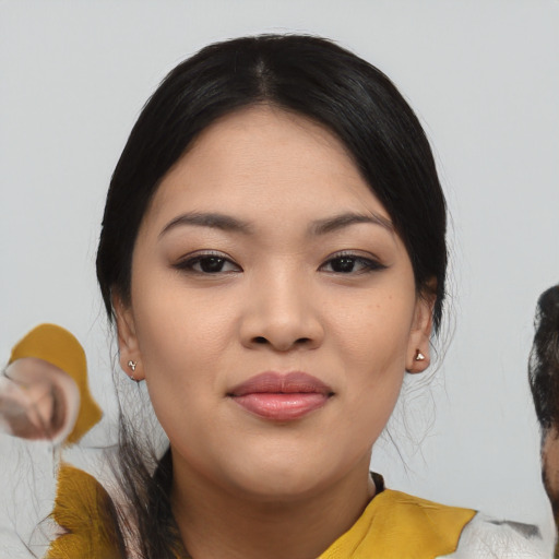 Joyful asian young-adult female with medium  black hair and brown eyes