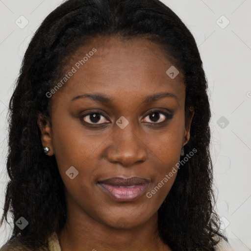 Joyful black young-adult female with long  brown hair and brown eyes