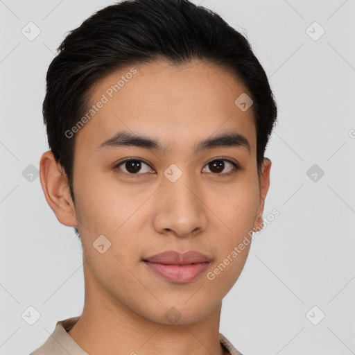 Joyful latino young-adult male with short  brown hair and brown eyes