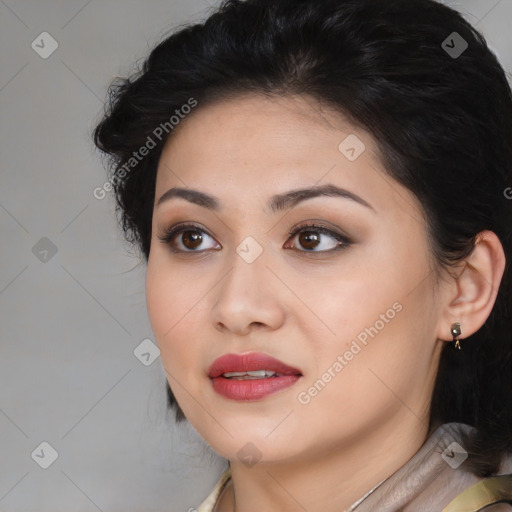 Joyful asian young-adult female with long  black hair and brown eyes