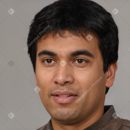 Joyful latino young-adult male with short  black hair and brown eyes