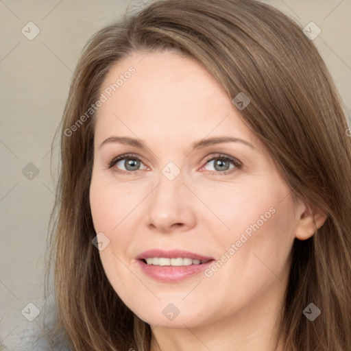 Joyful white adult female with long  brown hair and brown eyes