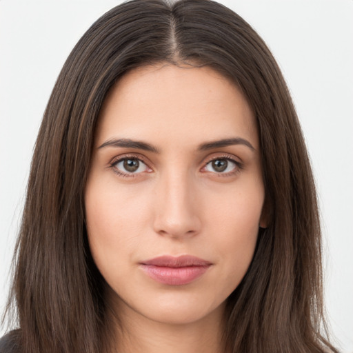 Neutral white young-adult female with long  brown hair and brown eyes