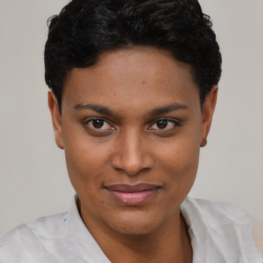Joyful latino young-adult female with short  black hair and brown eyes