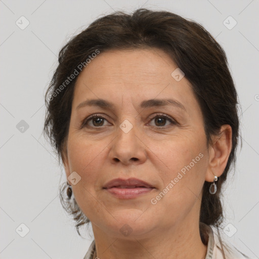 Joyful white adult female with medium  brown hair and brown eyes