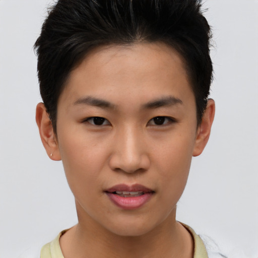 Joyful asian young-adult female with short  brown hair and brown eyes