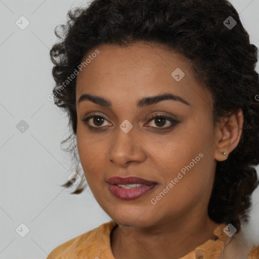 Joyful black young-adult female with long  brown hair and brown eyes