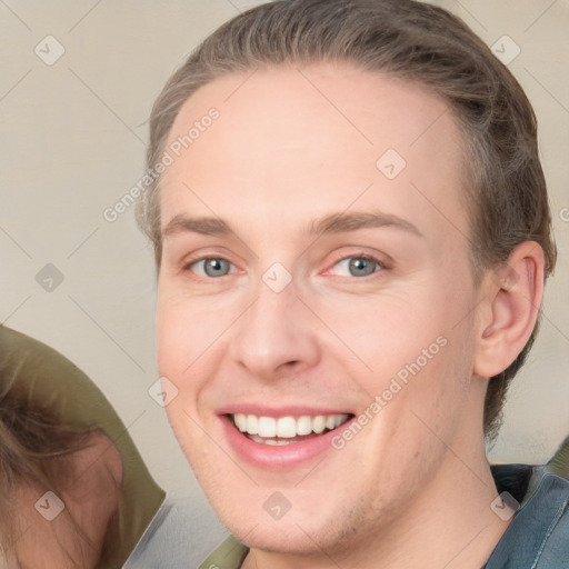 Joyful white young-adult female with medium  brown hair and grey eyes