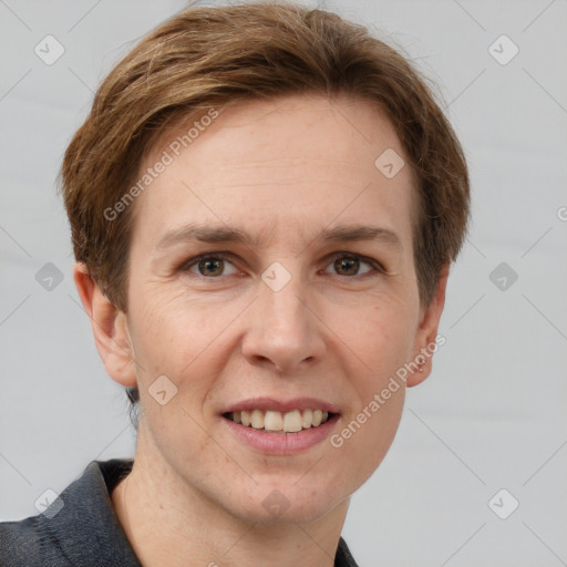 Joyful white adult female with short  brown hair and grey eyes