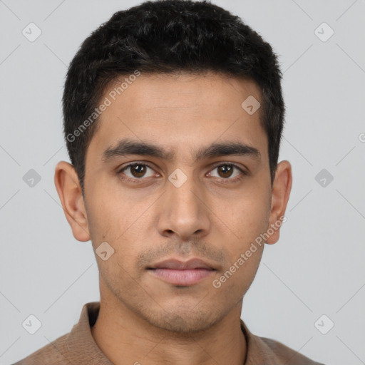 Neutral latino young-adult male with short  brown hair and brown eyes
