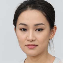 Joyful asian young-adult female with medium  brown hair and brown eyes