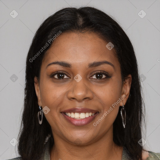 Joyful black young-adult female with long  brown hair and brown eyes