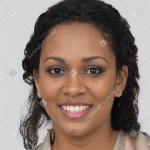 Joyful black young-adult female with long  brown hair and brown eyes