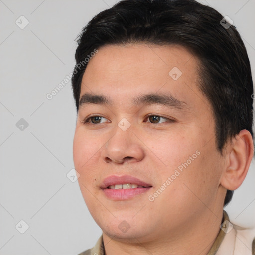 Joyful asian young-adult male with short  brown hair and brown eyes