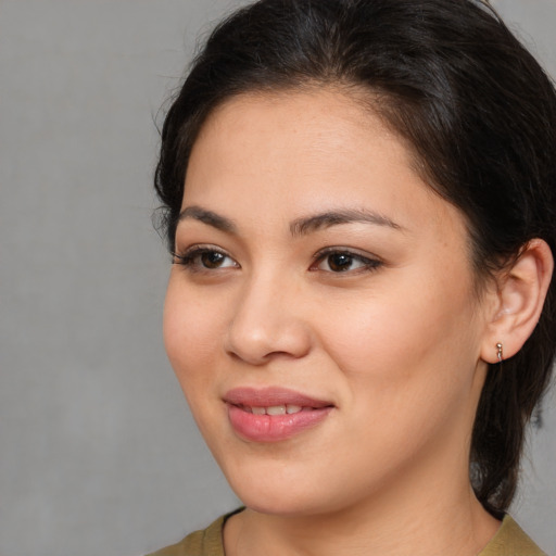 Joyful white young-adult female with medium  brown hair and brown eyes
