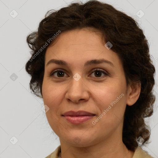 Joyful white adult female with medium  brown hair and green eyes